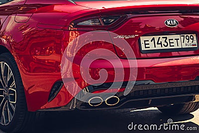 Moscow / Russia â€“ 08 31 2018: Red car Kia Stinger with showgirl on automotive Editorial Stock Photo